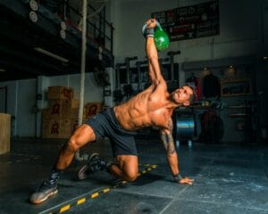 a man using a kettlebell