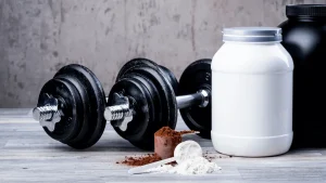 Bodybuilding Supplements That really works: RAD140 and Ostarine Powdres at gym background .