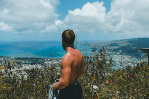 healthy-looking male on a cliff