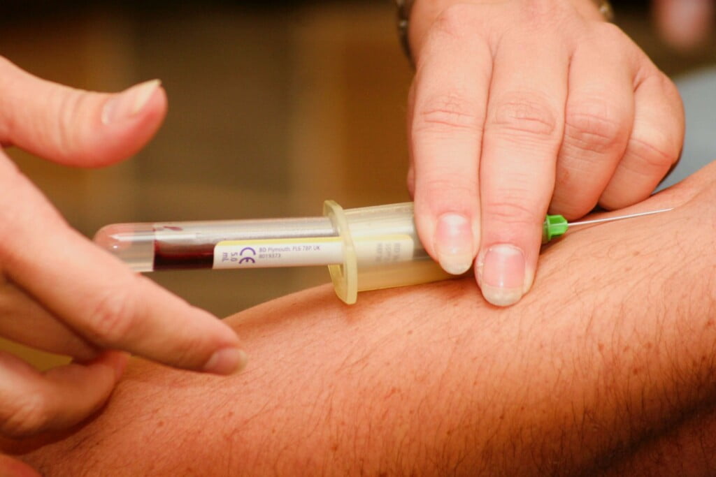 Medical professional injecting a patient