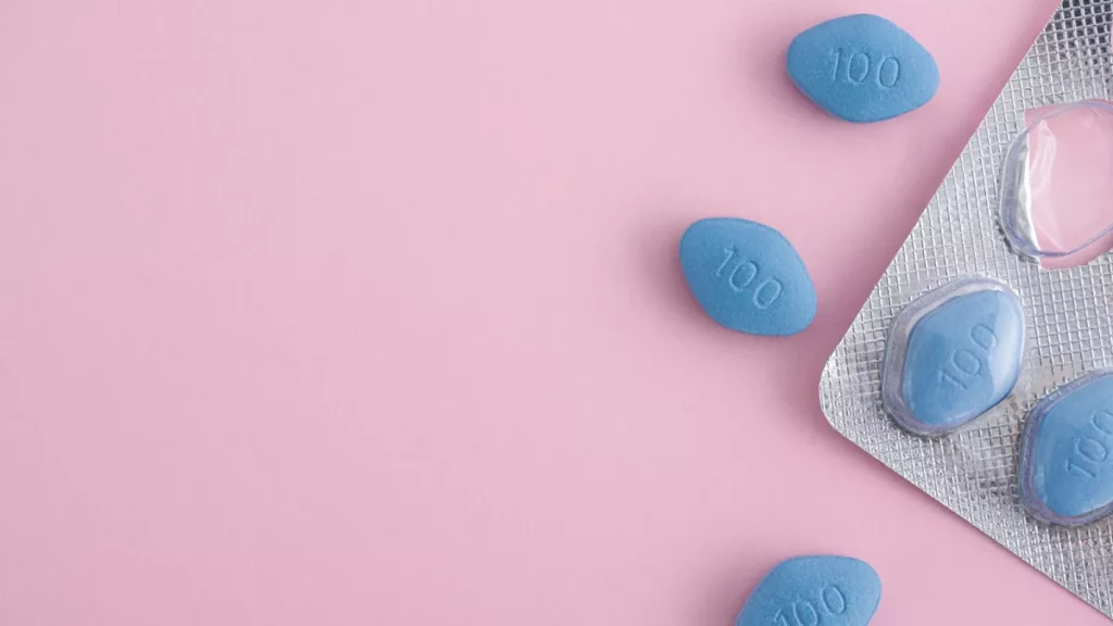 Viagra tablets on pink background